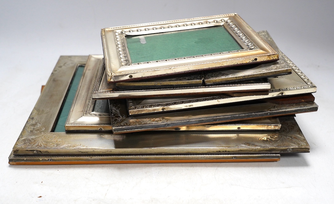 Nine assorted late 20th century 800 standard white metal mounted photograph frames, mainly Italian, including a double frame, largest 29.6cm. Condition - poor to fair